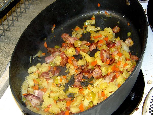 After sweating mirepoix, add apple and bacon