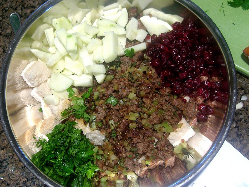 Add apples, parsley and cranberries to the mix, and combine.