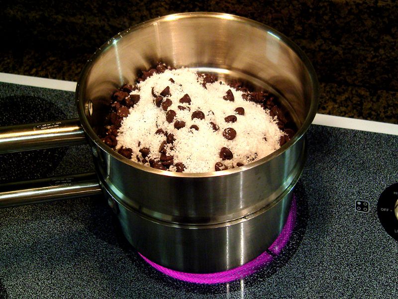 Mix chocolate chips and paraffin together and melt on double boiler