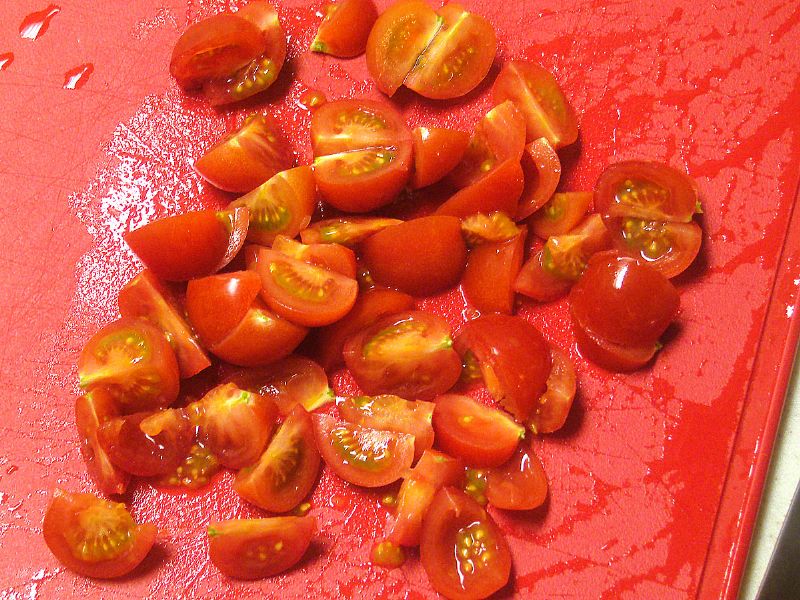Quarter cherry tomatoes.