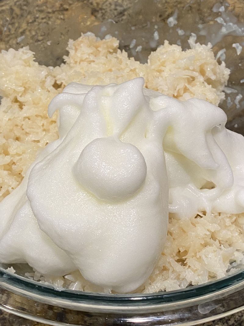 Stiff peaks.  Fold egg whites into coconut mixture.