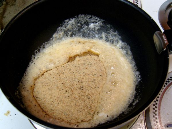 Add breadcrumbs to melted butter to toast