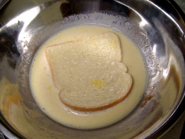 Coat bread with batter