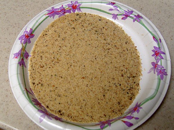 Add breadcrumbs to plate. Mix in parmesan cheese (not shown)