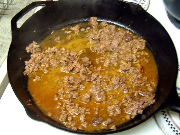 Add taco seasoning and water (as indicated on taco seasoning directions).  Drain if required.