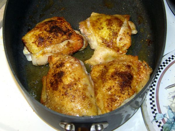 Brown the chicken thighs in bacon grease