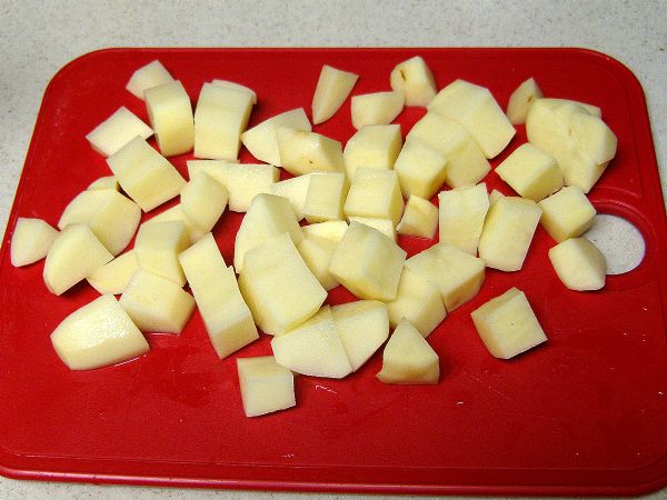 Chop potatoes into cubes