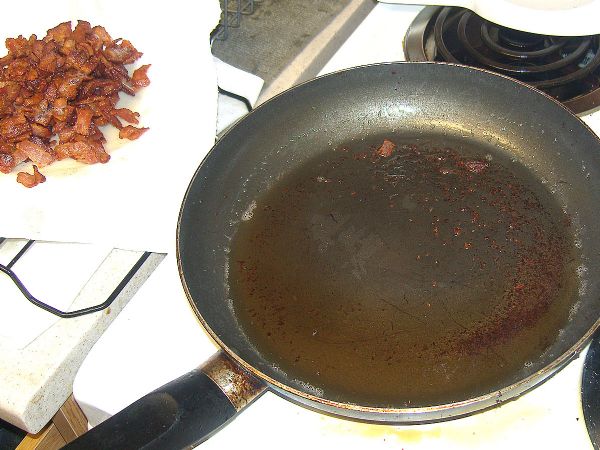 Use slotted spoon to remove bacon and then drain off most of the fat.