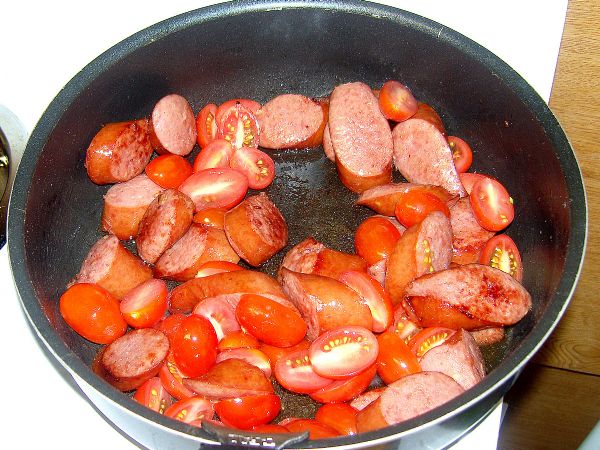 Add tomatoes to Kielbasa