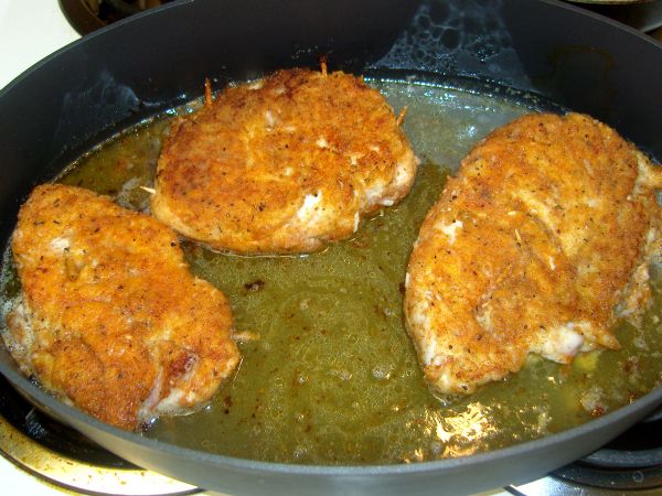 Turn again after 7-8 minutes. Add wine and chicken broth.