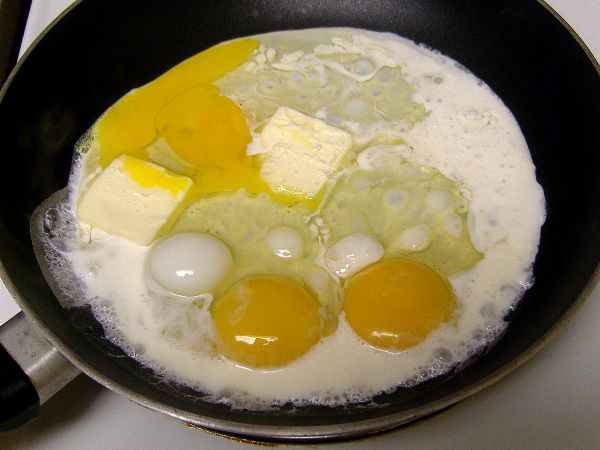 Add to hot pan.  The eggs will begin cooking immediately.  Start to stir with a spatula as soon as y