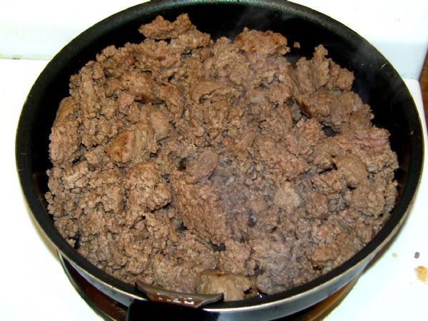 Brown ground beef.  Don't overcook. Drain.  Set aside (it will reheat in the sauce later).
