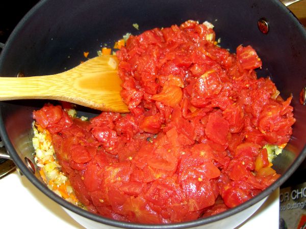 Add tomatoes to mirepoix.