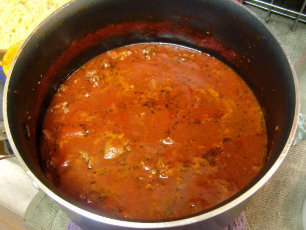The sauce is reduced by half (you can see the lines on the pot where it reduced)