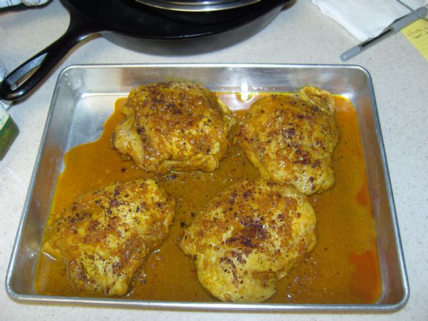 Add crushed star-anise to top of chicken thighs 30 minutes before baking