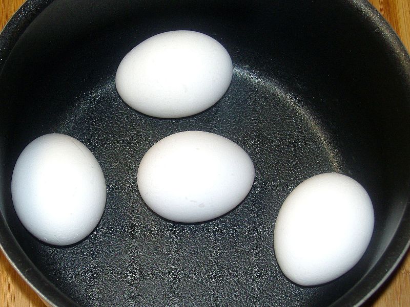 Gently place eggs into pot.