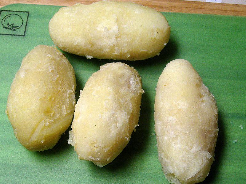 Cook potatoes. Peel.