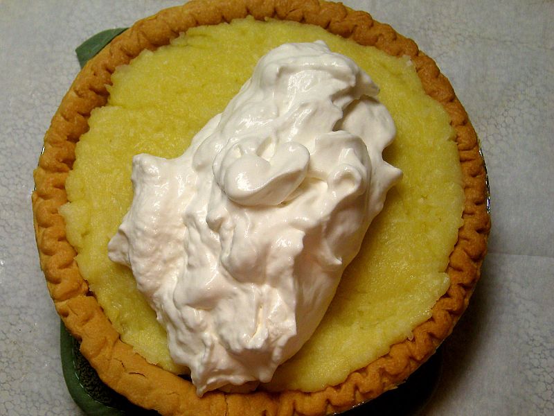 Put topping on pie.