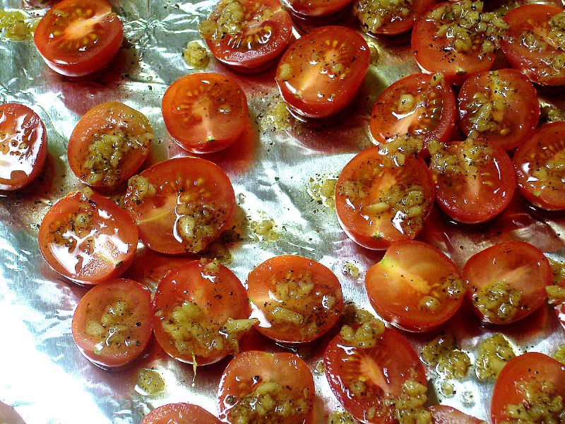 Drizzle remaining oil over tomatoes
