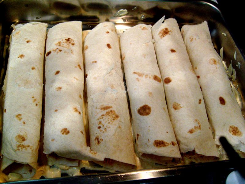 Place enchiladas in pan over the soup mixture.