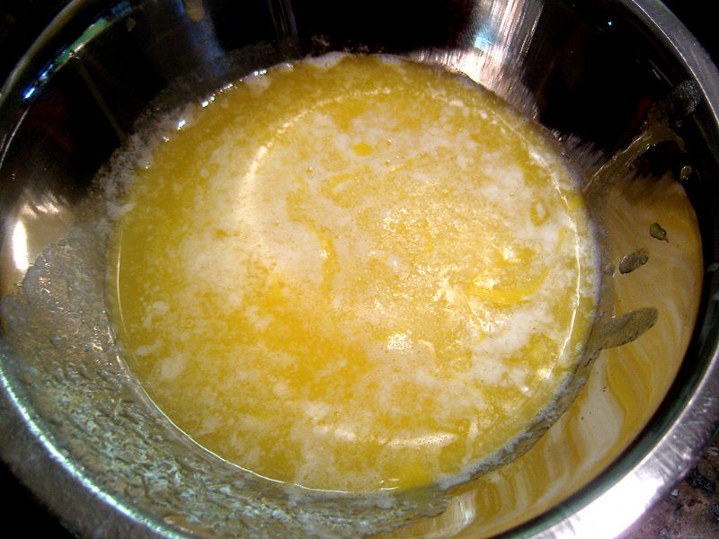 Temper the egg yolks with the butter (if the butter is too hot, the egg will begin to scramble)