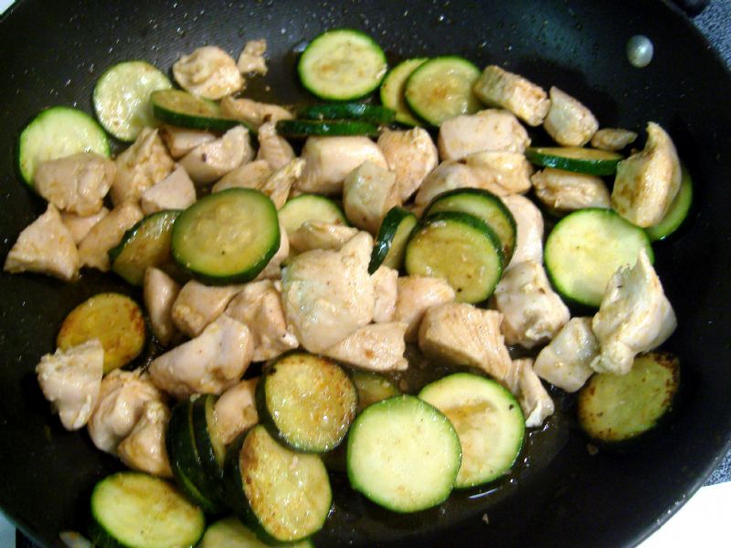 Add cayenne and cumin.  Return chicken to pan to continue cooking.