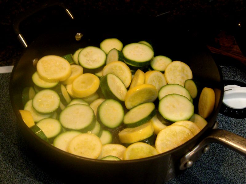 Heat oil.  Add zucchini and squash.