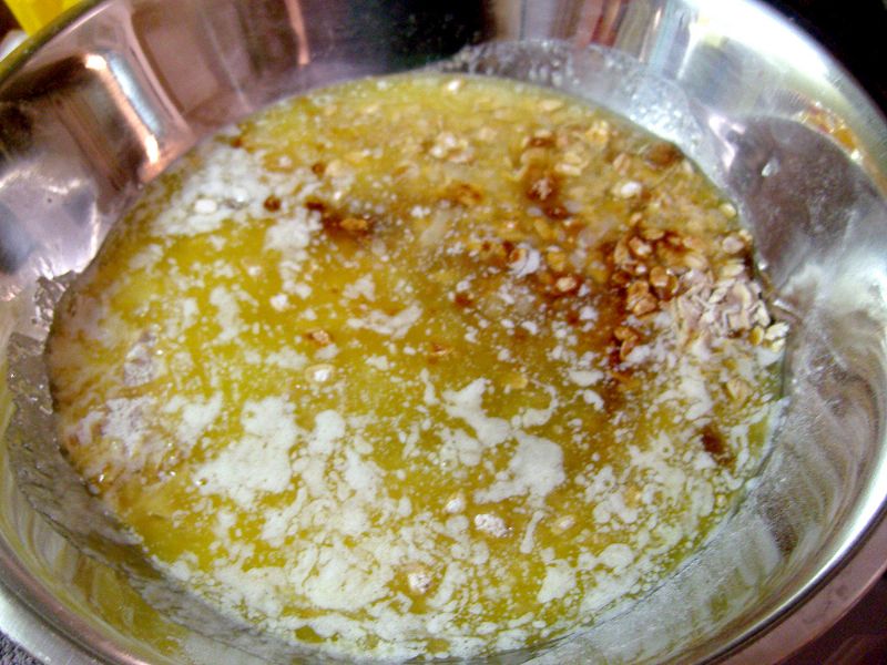 Pour melted butter over oat mix