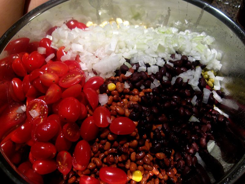 Add the halved tomatoes and diced onions (or other optional non-canned veggies)
