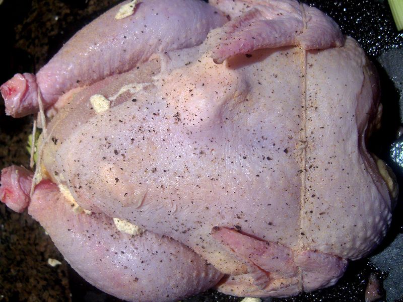 Truss chicken, add margarine dollops under skin, salt, pepper and season