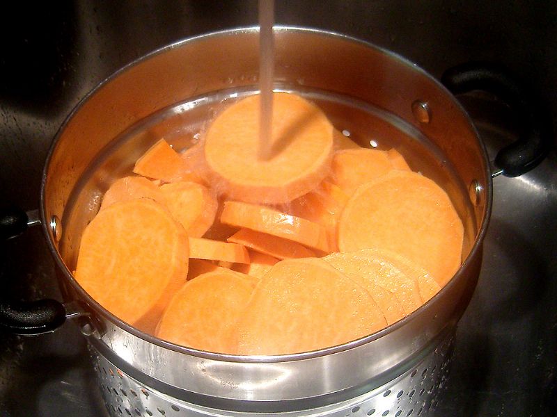 Give the apples and sweet potatoes a rinse in the colander