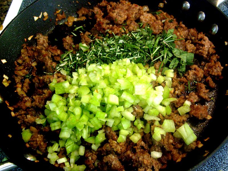 Add herbs and celery to sausage mix