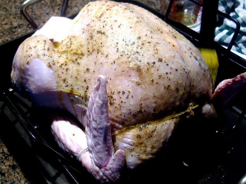 Baste the outside of the turkey with the oil mixture