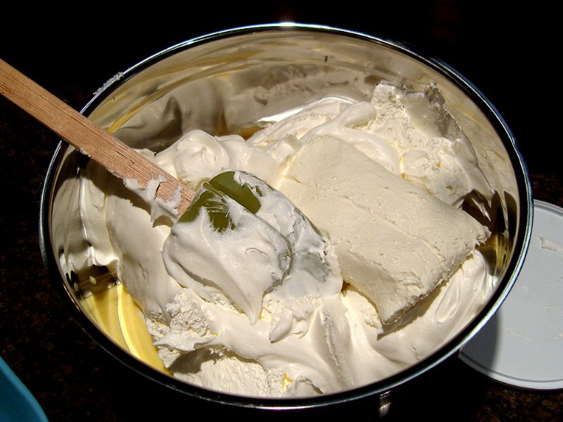Place pudding, whipped topping and softened cream cheese in a bowl.