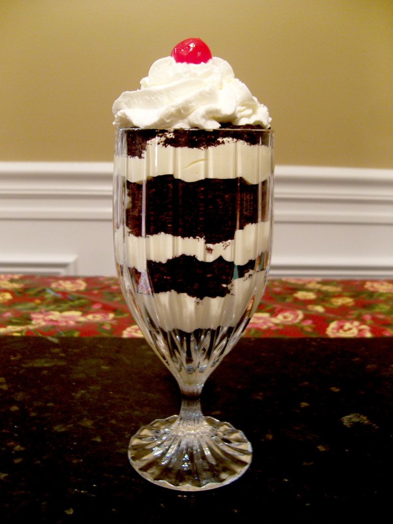 Dirt Pudding with whipped cream and cherry on top