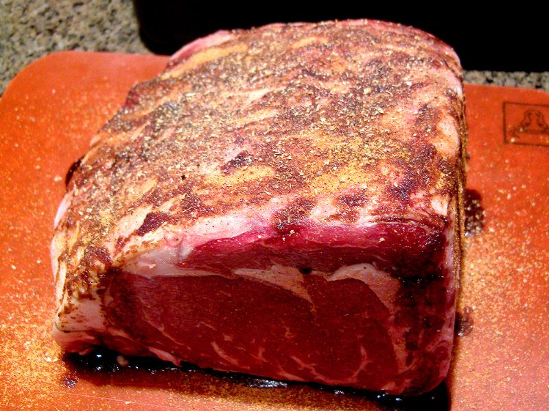 Add pepper, seasoned salt and other spices to top of the prime rib.