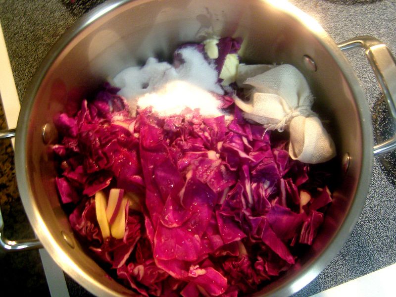 Add cabbage, apples, onions, liquids, spices, sugar and butter to stockpot. Bring to boil.