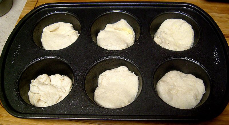 Put biscuit dough in muffin pan.