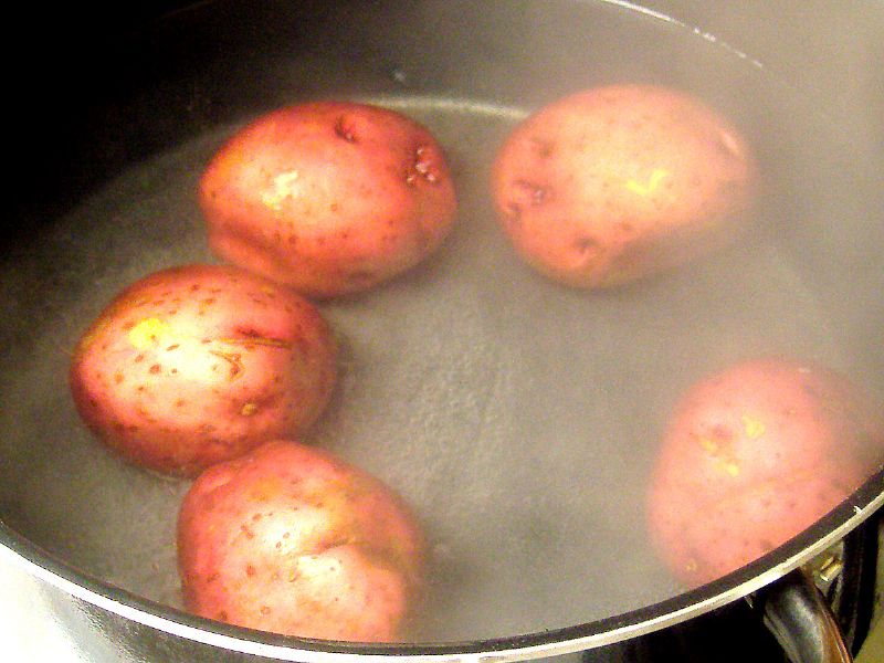 Add potatoes to salted boiling water.  Cook for around 25 minutes.