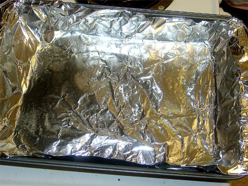 Lightly grease the aluminum foil lined pan