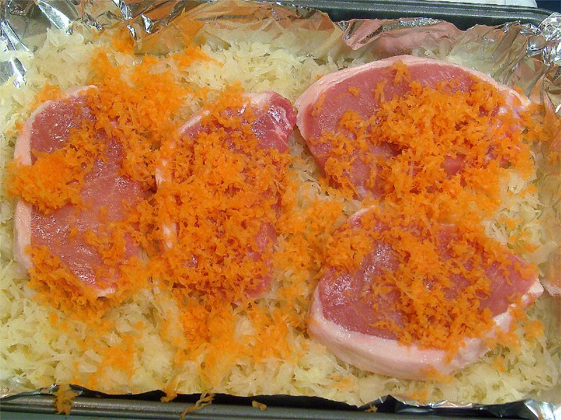 Grate carrots over chops.