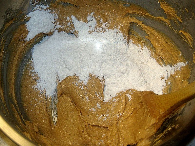 After beating in the egg and vanilla (not shown), fold in the flour combination.
