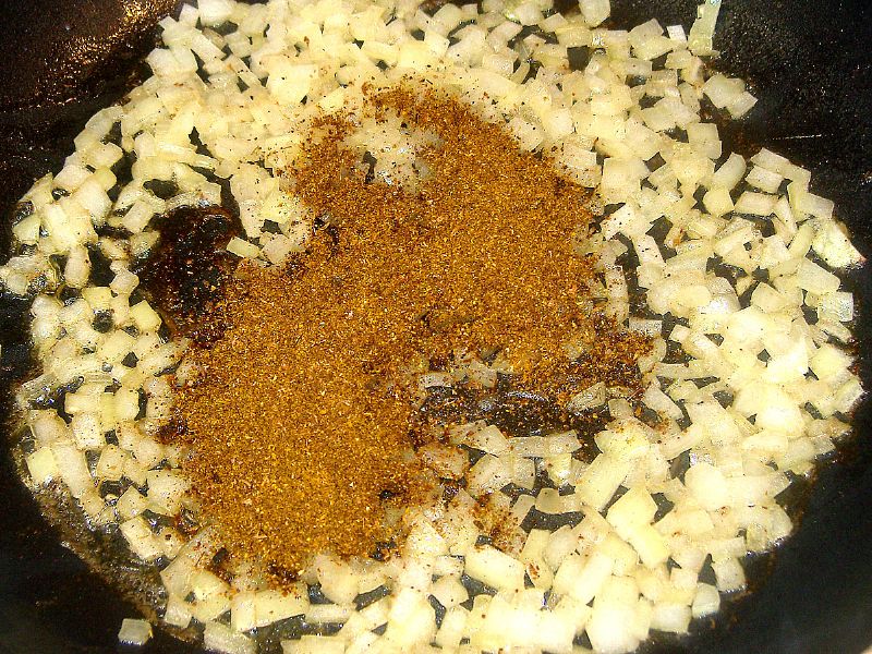 Add 1 teaspoon curry powder to the remaining coriander/fennel/cumin.  Add to the onions.
