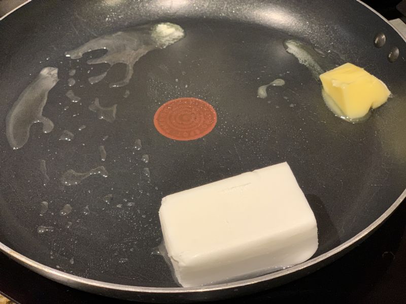 Melt butter and crisco in skillet.