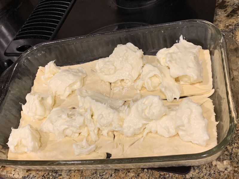 Place cream cheese on top of crescent rolls