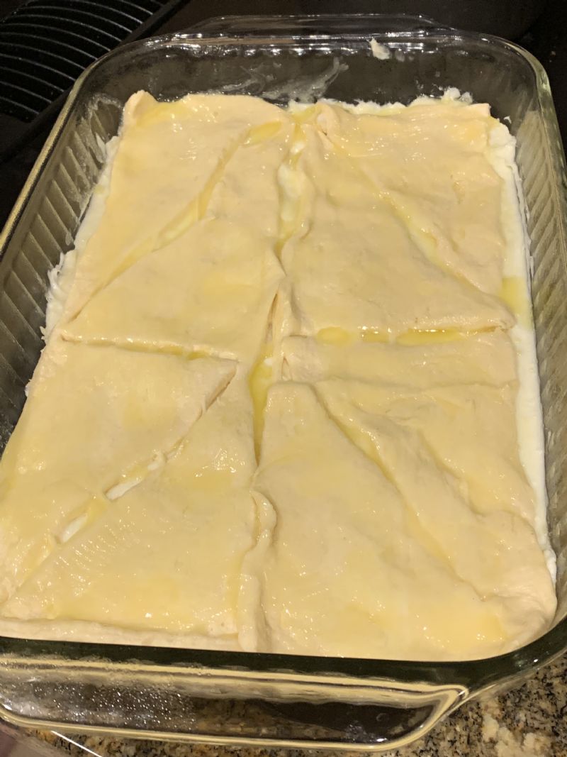 Brush butter over the crescent rolls.