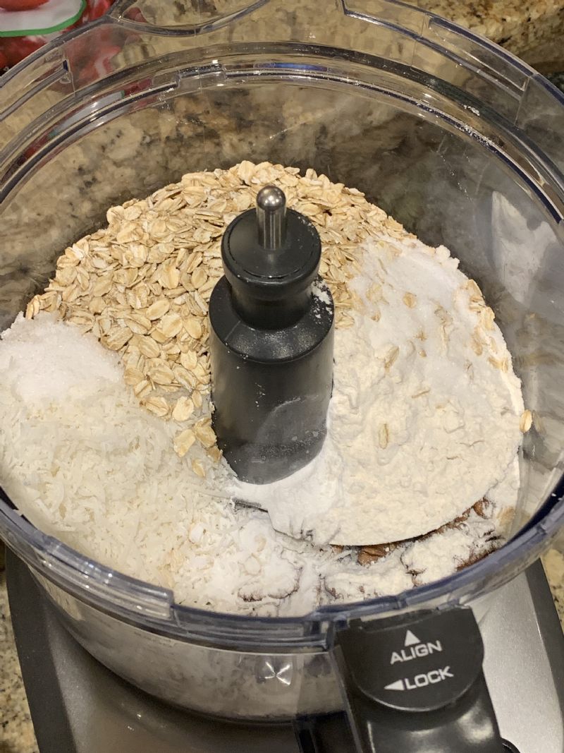 Place dry ingredients in food processor