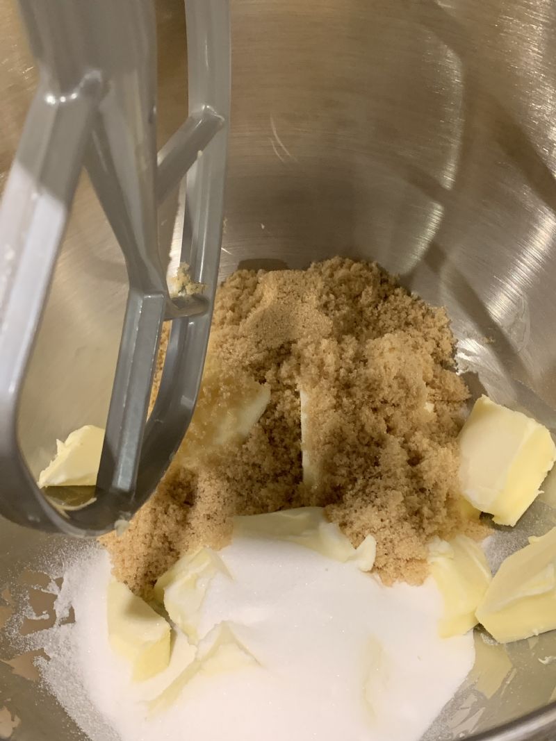 Place butter and sugars into a stand mixer