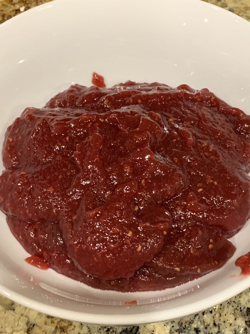 Warm raspberry jam in microwave for 1 minute.