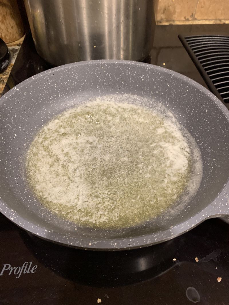 Melt 1/4 cup butter for toasting the walnuts